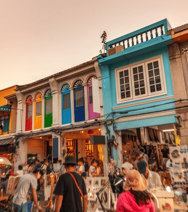 Colorful shophouses along a busy Phuket Old Town street
